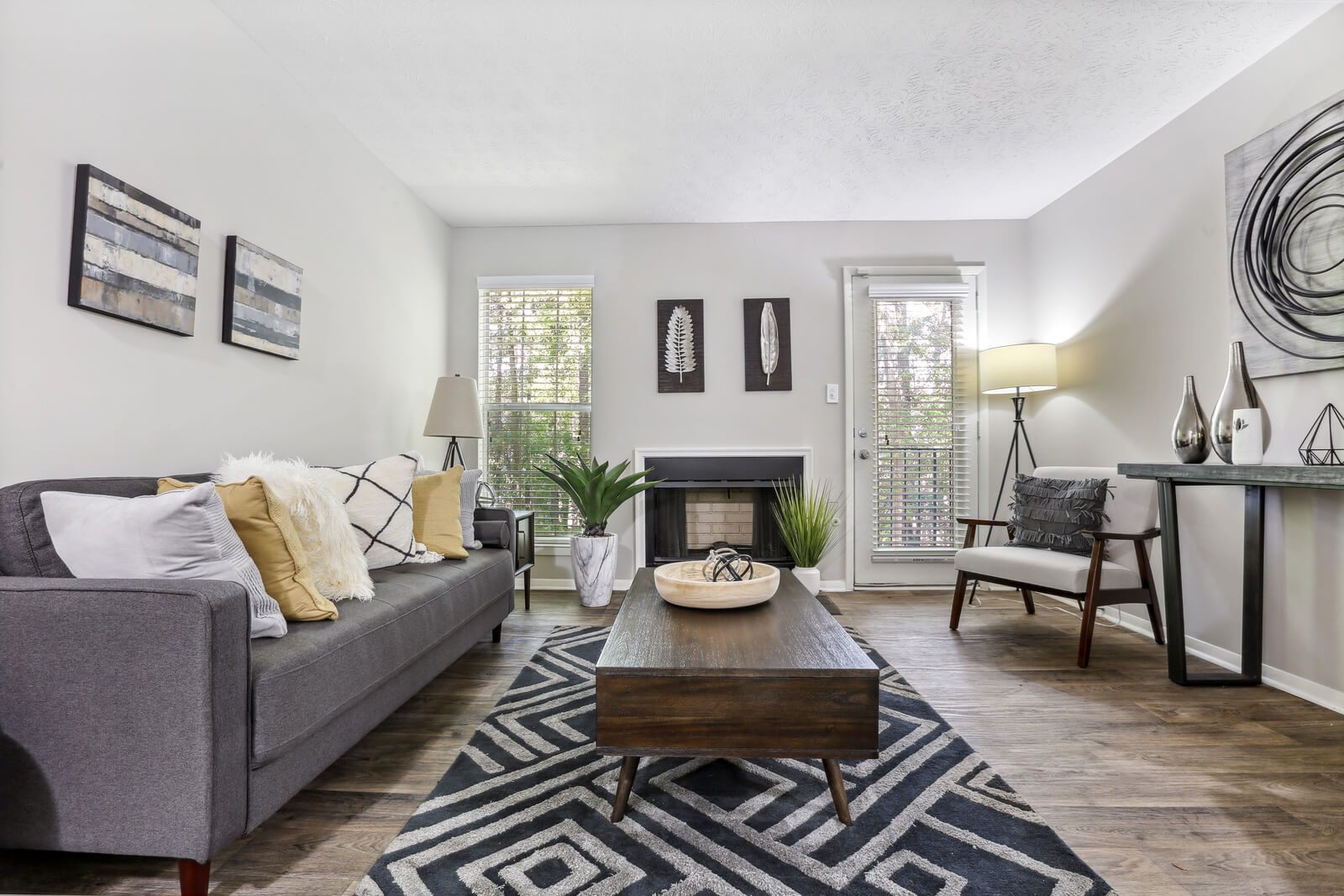 model living room with modern furniture and fireplace