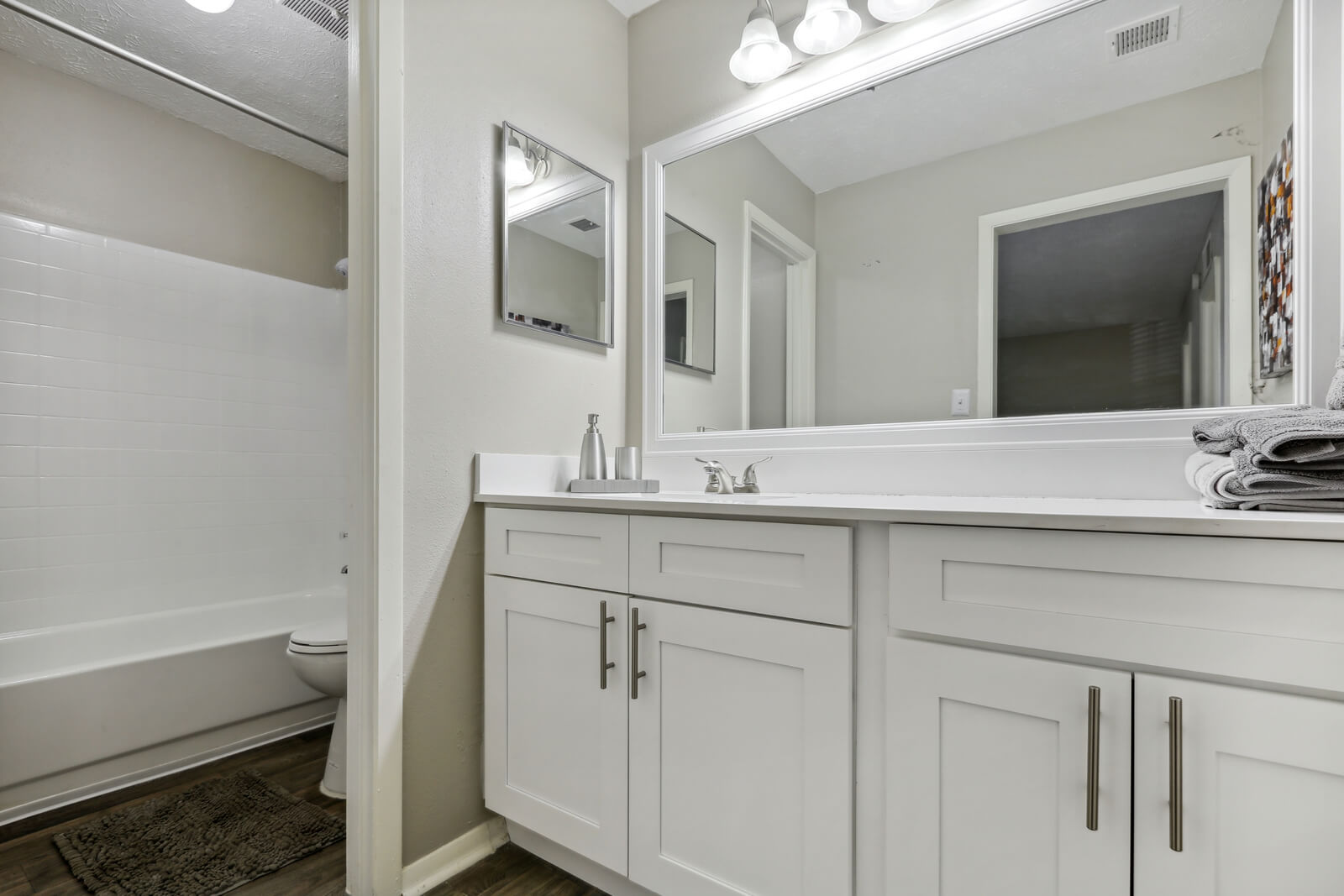 white shaker cabinetry in bathroom
