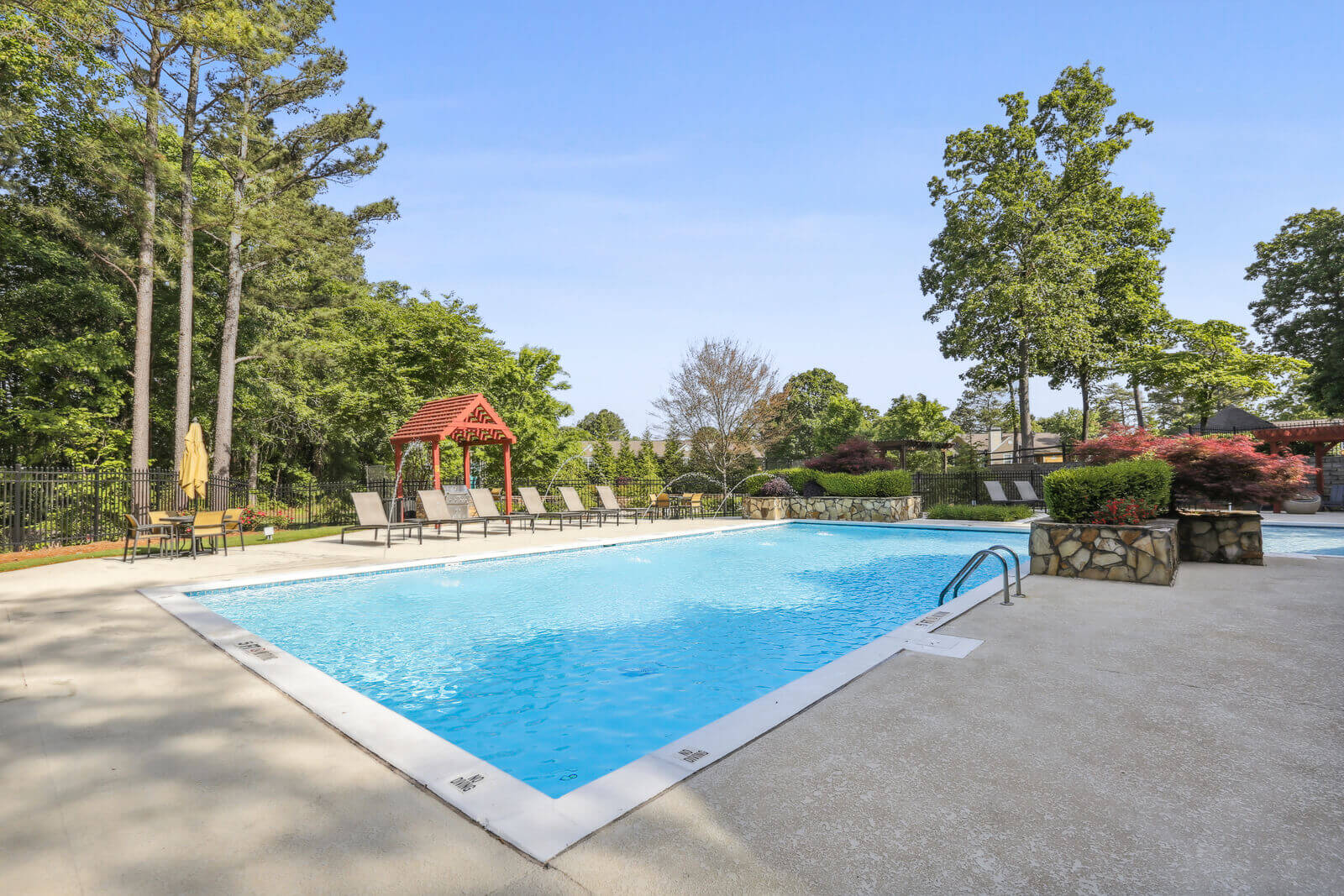 resort-style pool surrounded by beautiful landscape
